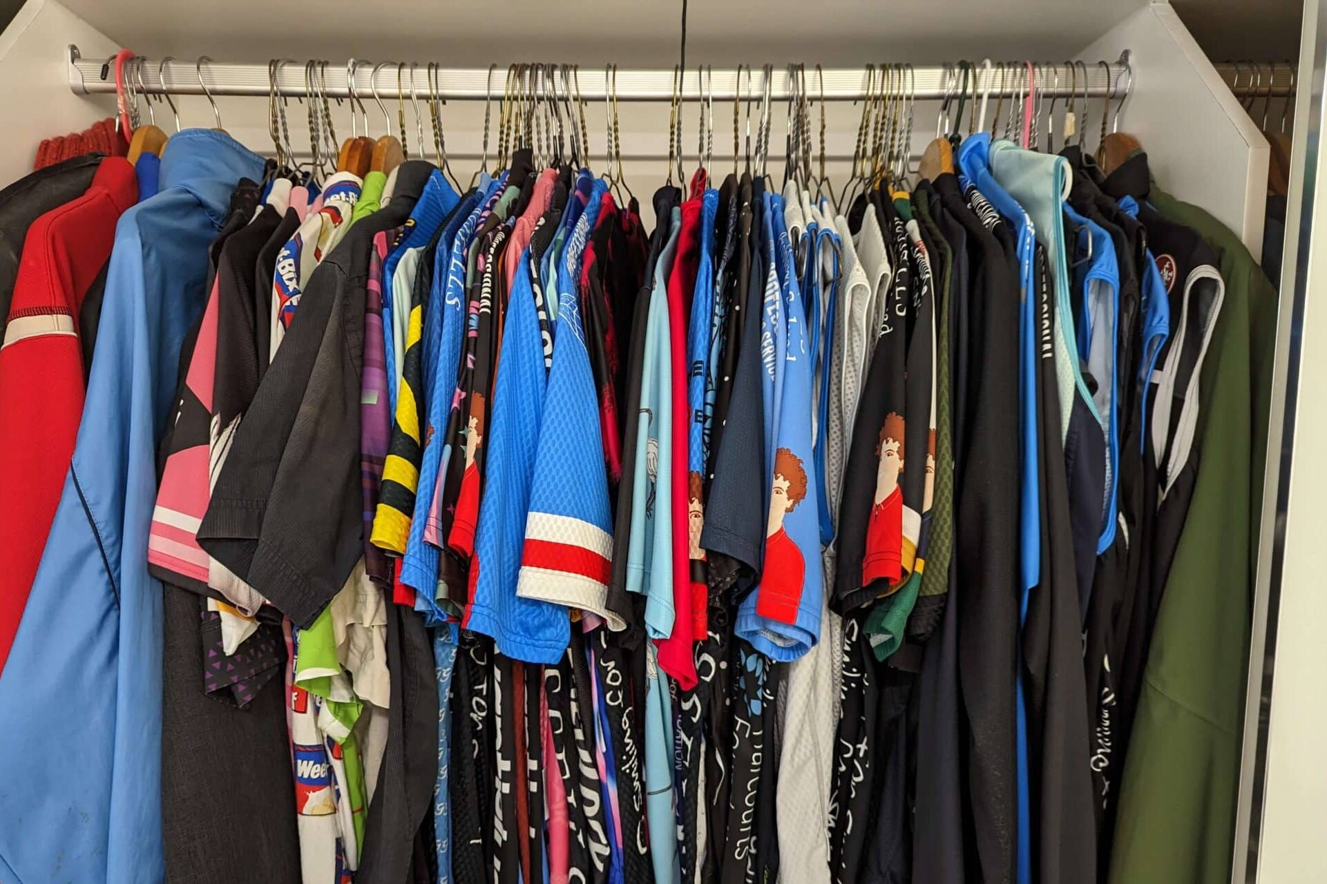 A wardrobe full of cycling jerseys